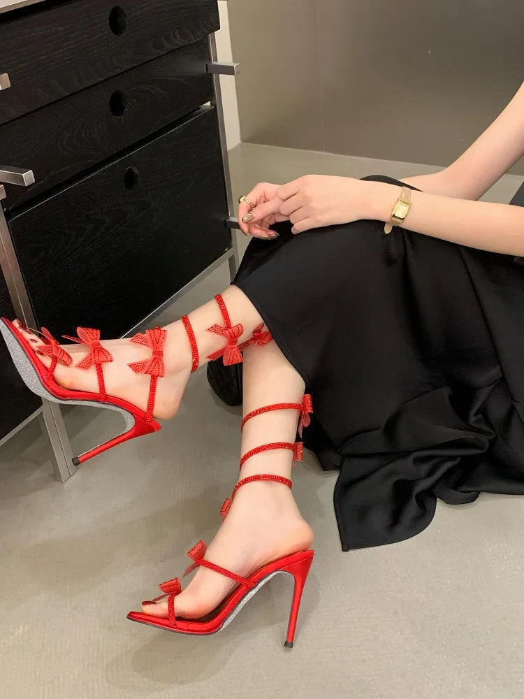 Aneikeh Elegant Pink Wedding Shoes CRYSTAL Bow High Heels Sandals Woman Summer Ankle Strap Thin High Heels Open Toed Party Shoes